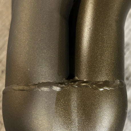 ZyClear over Zybar Bronze Satin. The treated side is on the right.